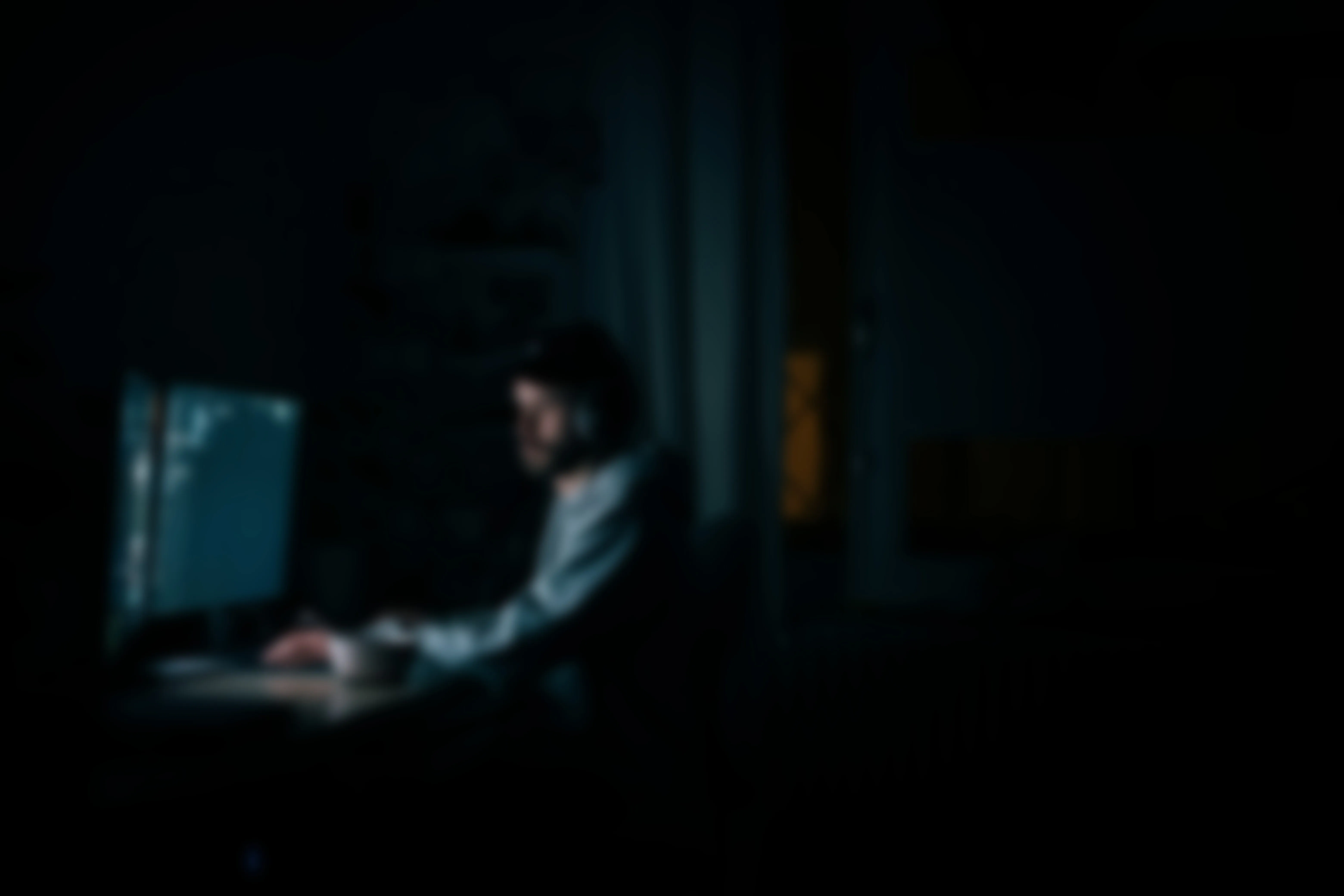 Image of person coding at night